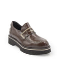 Brown leather shoe with a strap on a white background