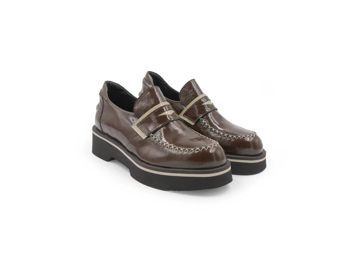 Pair of brown leather shoes with white stitching on a white background