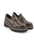 Pair of brown leather shoes with white stitching on a white background