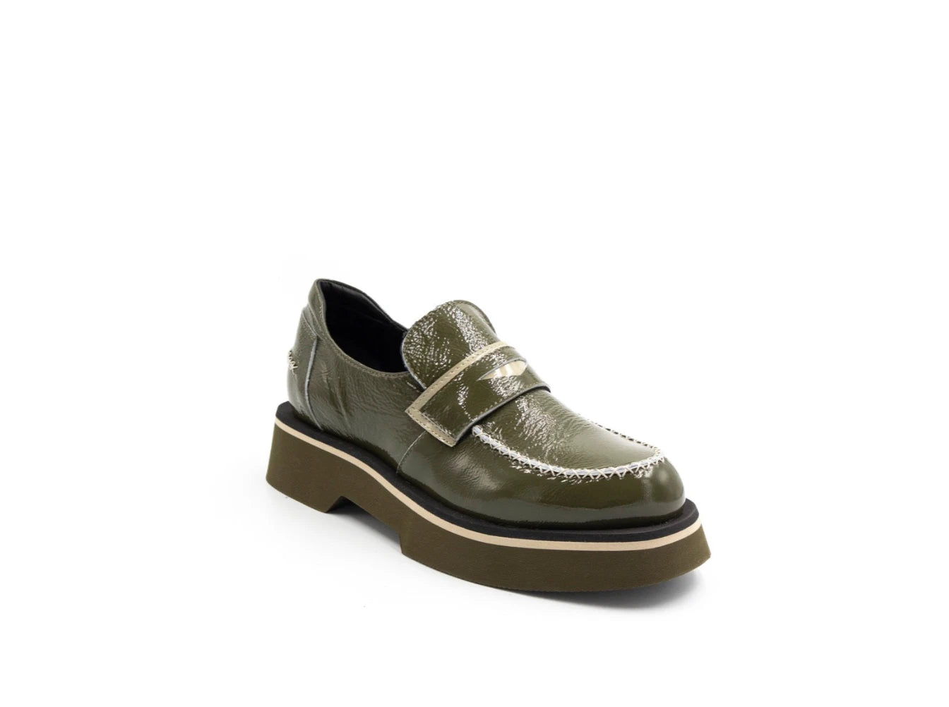 Green leather shoe with a thick sole on a white background