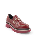 Red leather shoe with a strap on a white background