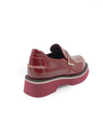 Red platform shoe on a white background