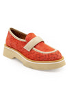 A red flat shoe with a white strap and a beige sole, designed for women.