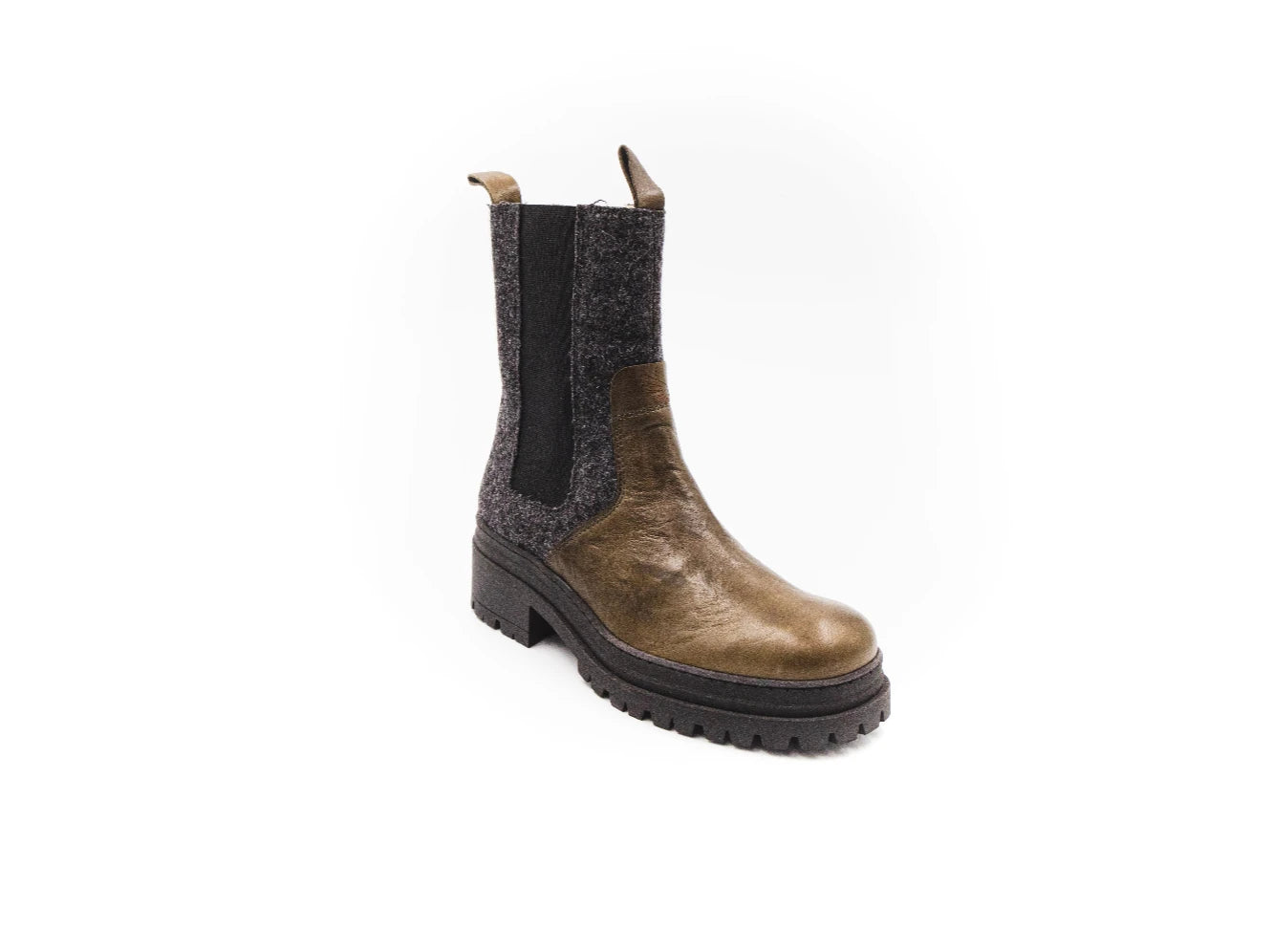 Brown Chelsea boot with black sole on a white background