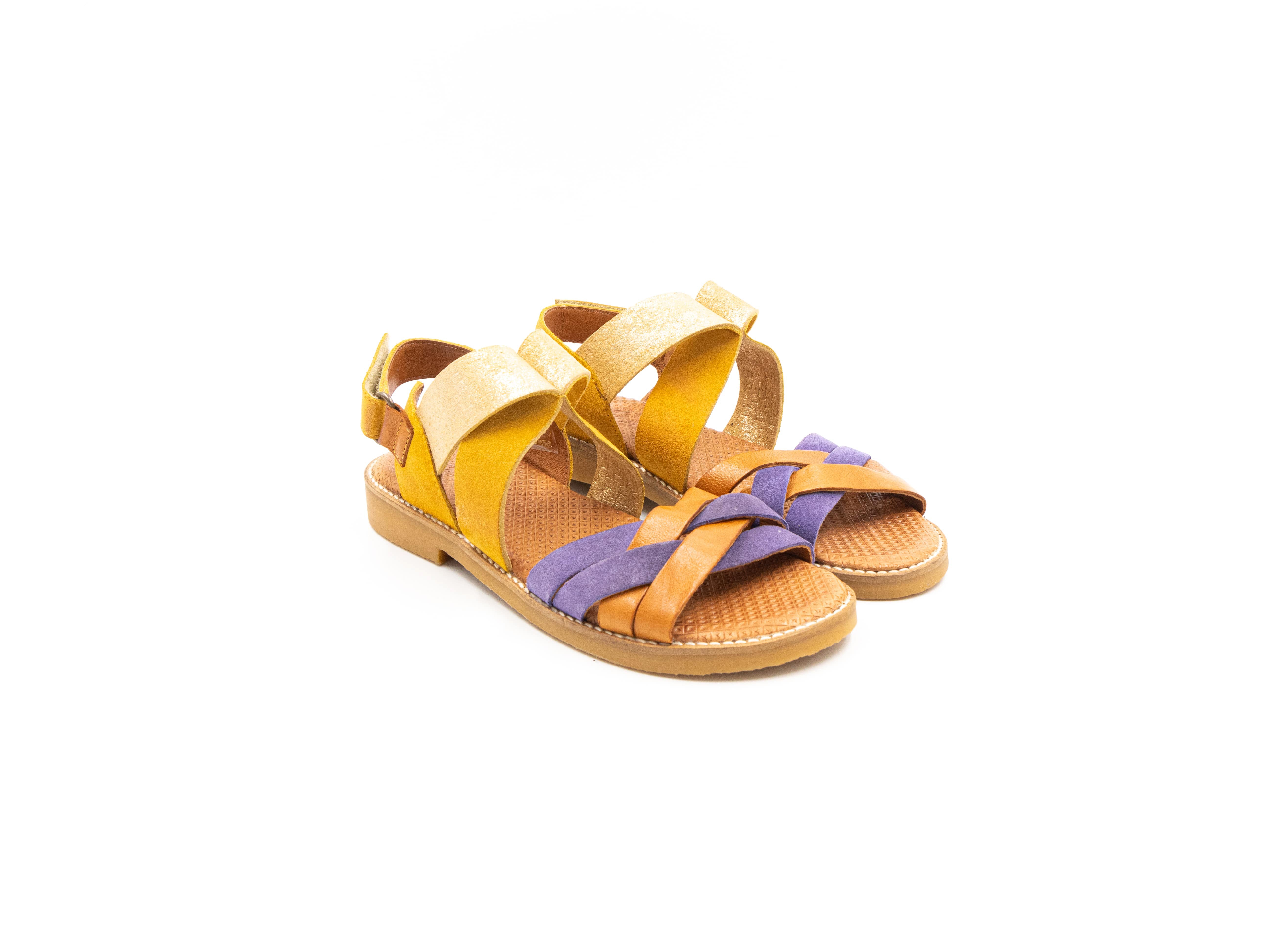 Flat sandals in yellow and purple.