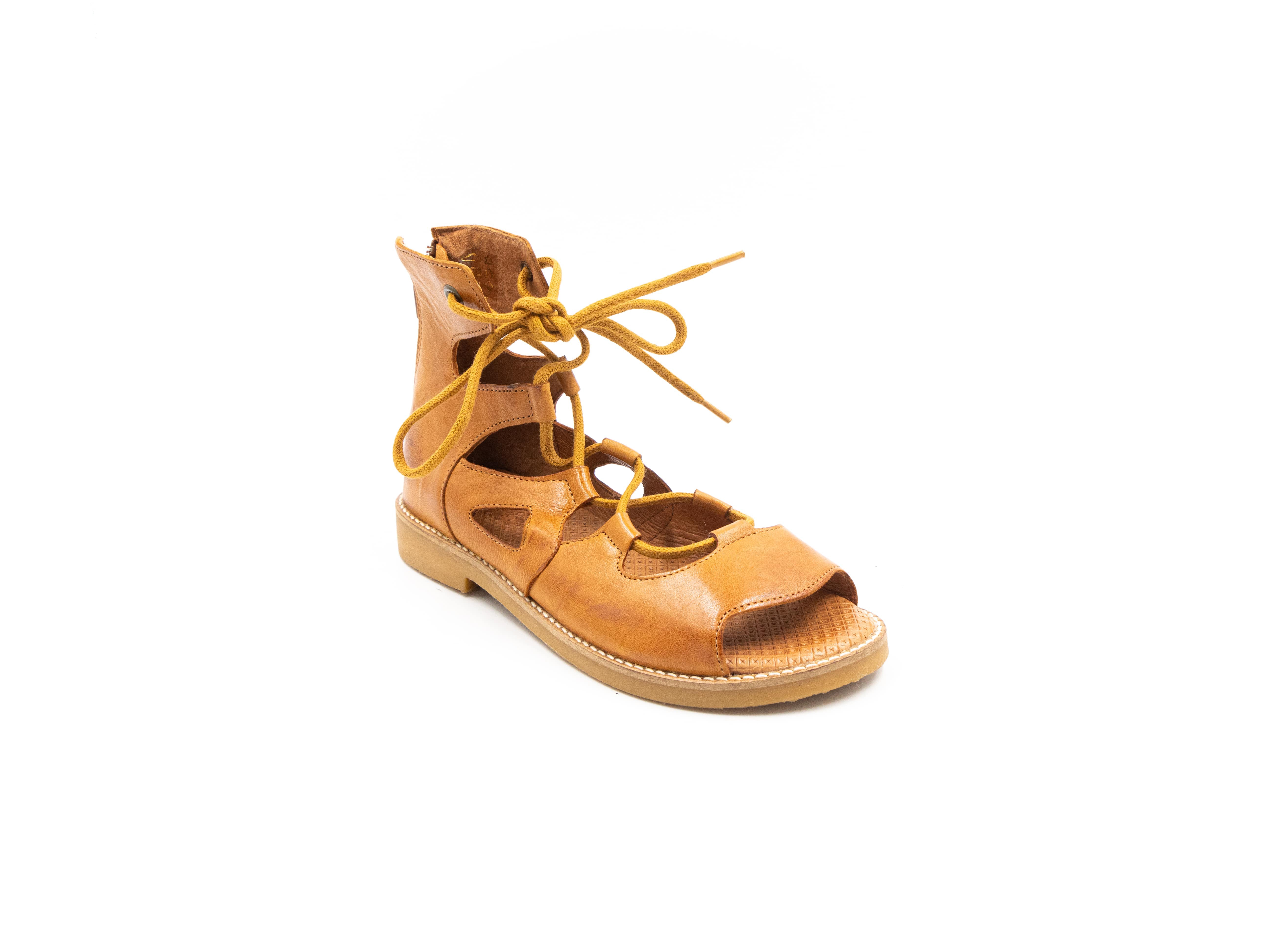Roman-style sandals in cognac tones.