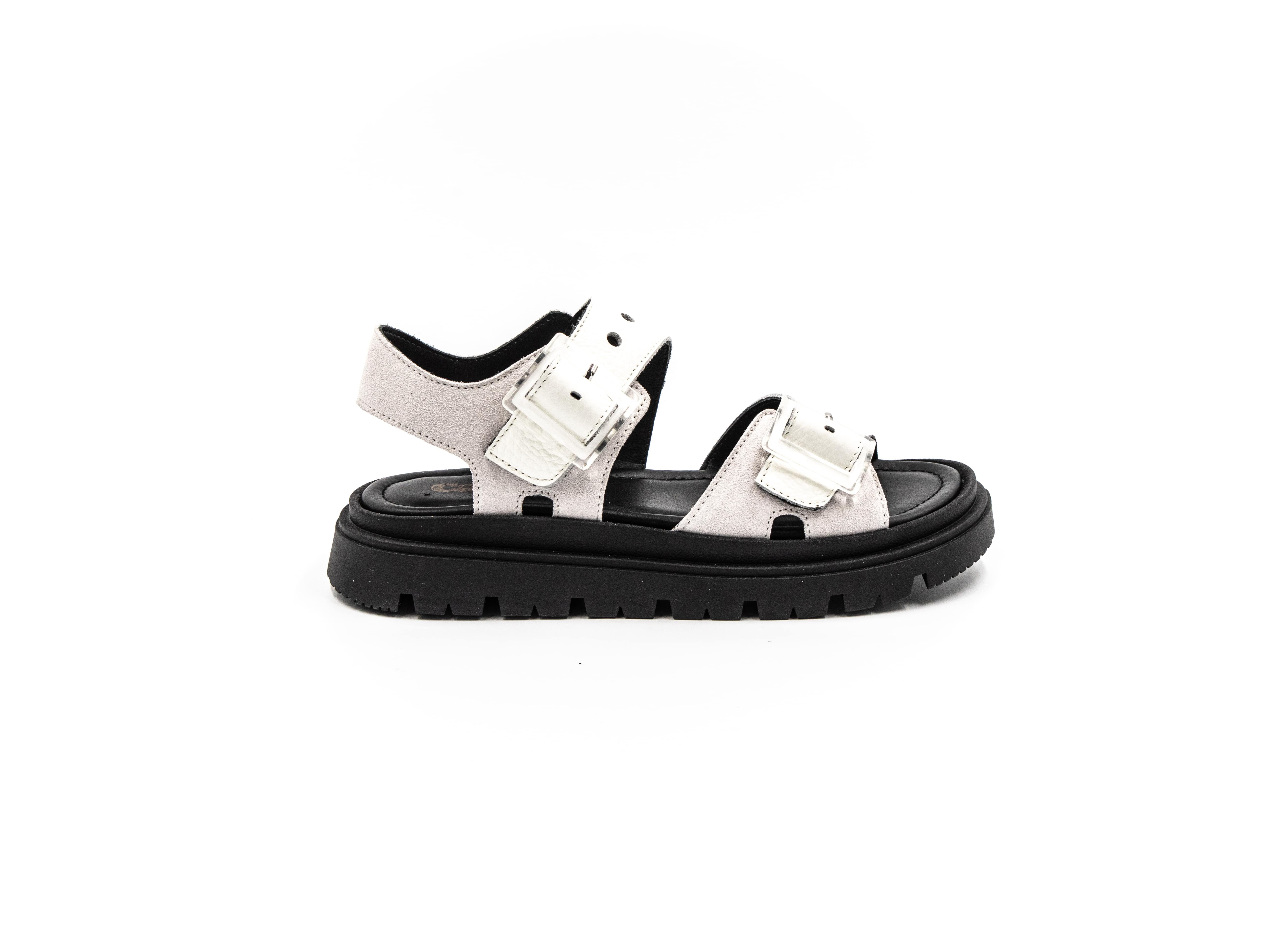Flat sandals in silver and black.