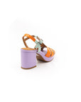 Heeled sandals in violet, orange and aqua green.