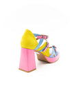 Heeled sandals in pink, blue and yellow.