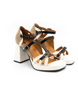Heeled sandals in black, white and brown.