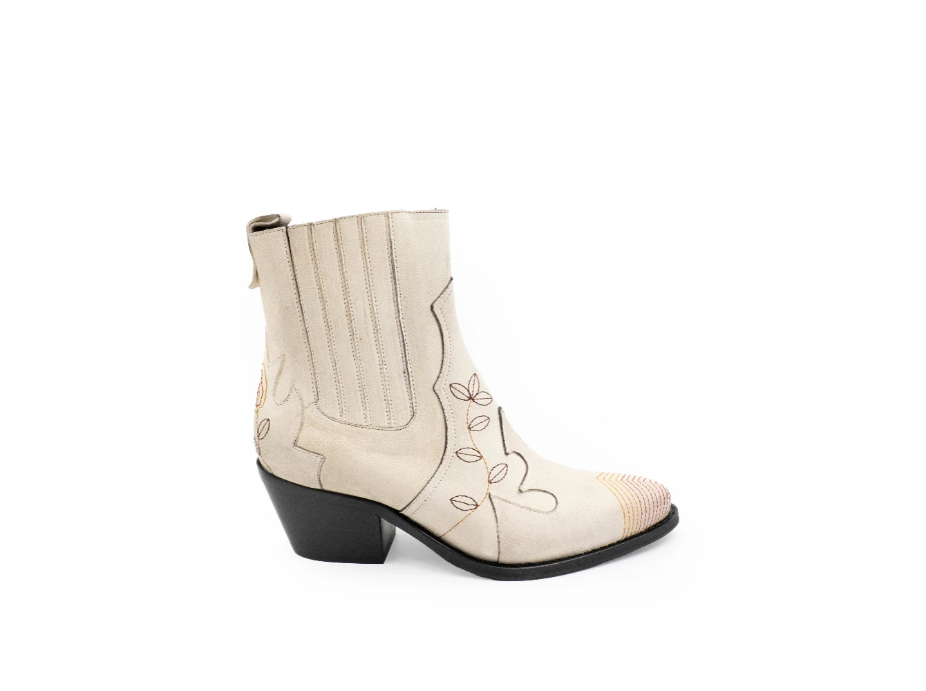 White ankle boot with black heel on a white background