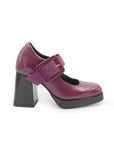 Purple high-heeled shoe with a strap on a white background