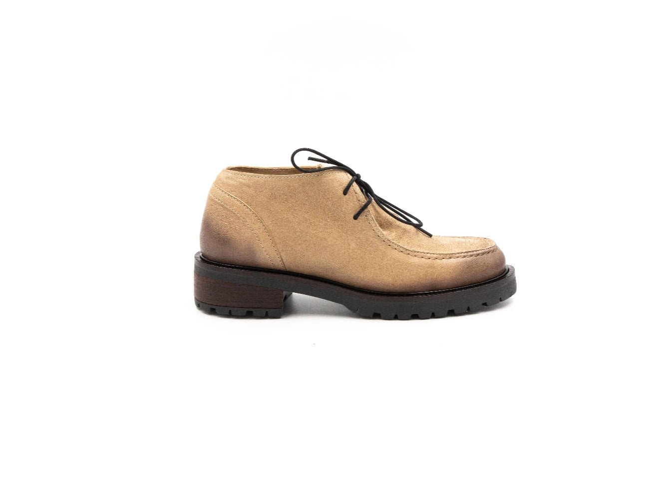 Tan leather shoe with black sole on a white background