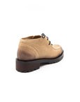 Beige leather shoe on a white background