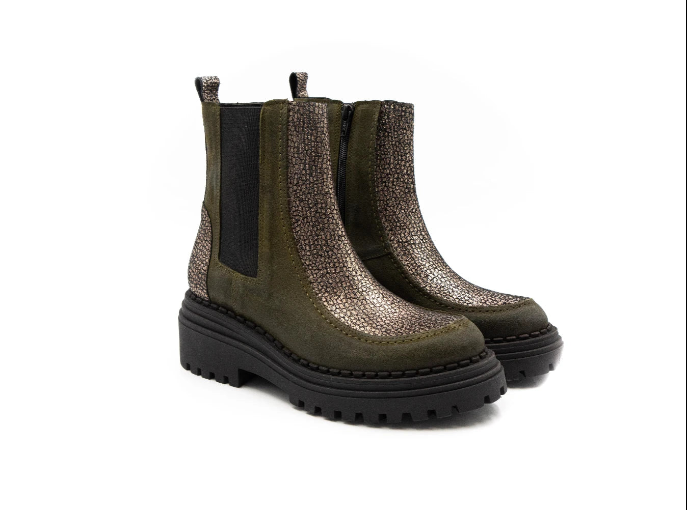 Pair of green Chelsea boots with black soles on a white background