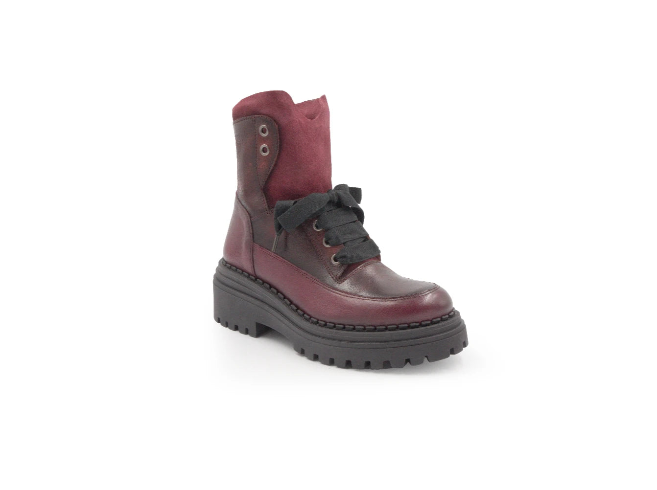 Brown and red leather boot on a white background