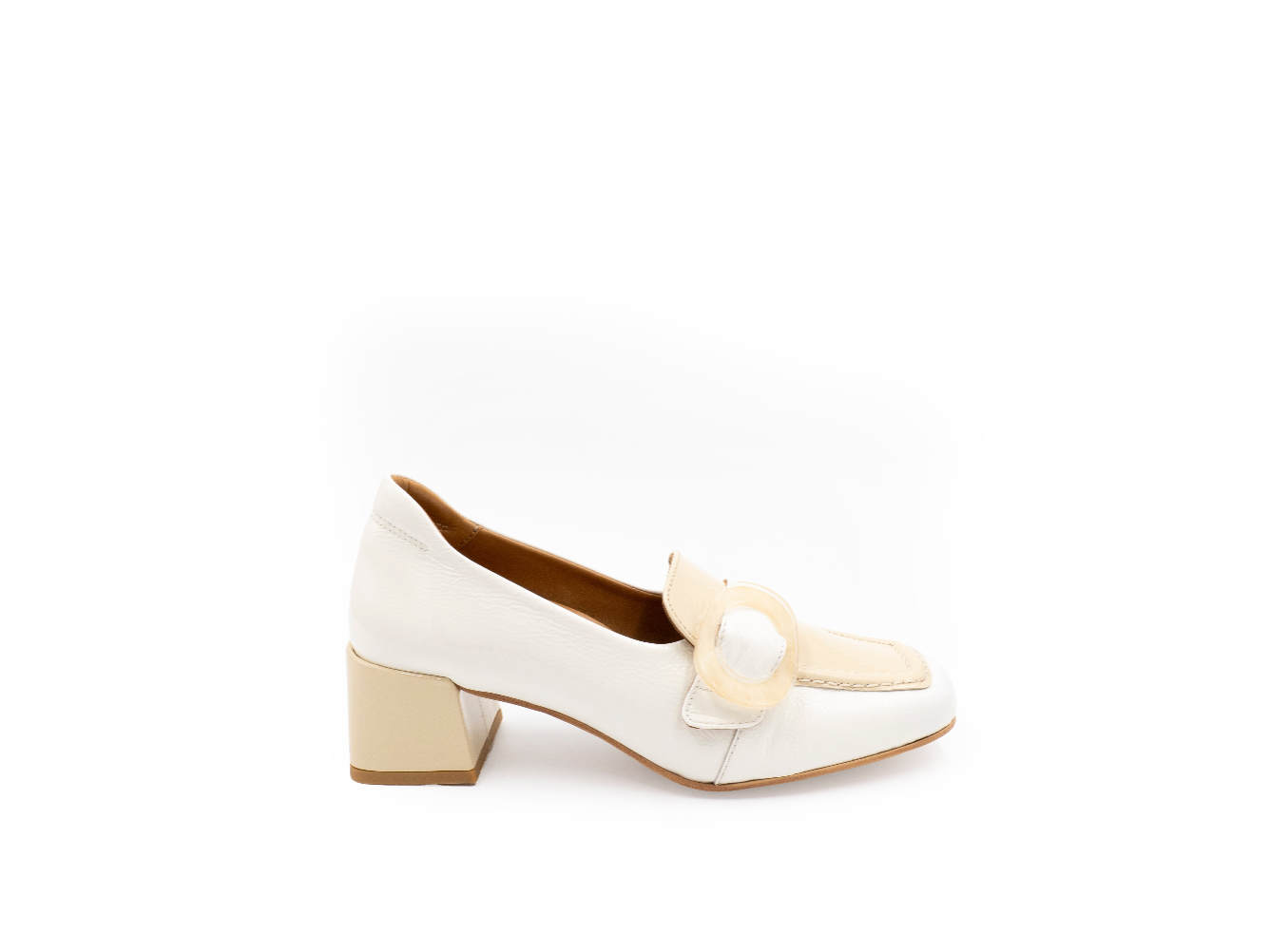 White shoe with a decorative strap on a white background