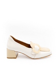 White shoe with a decorative strap on a white background