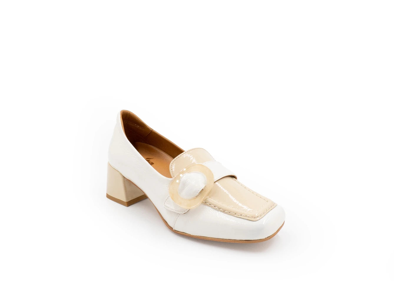 White shoe with a decorative strap on a white background
