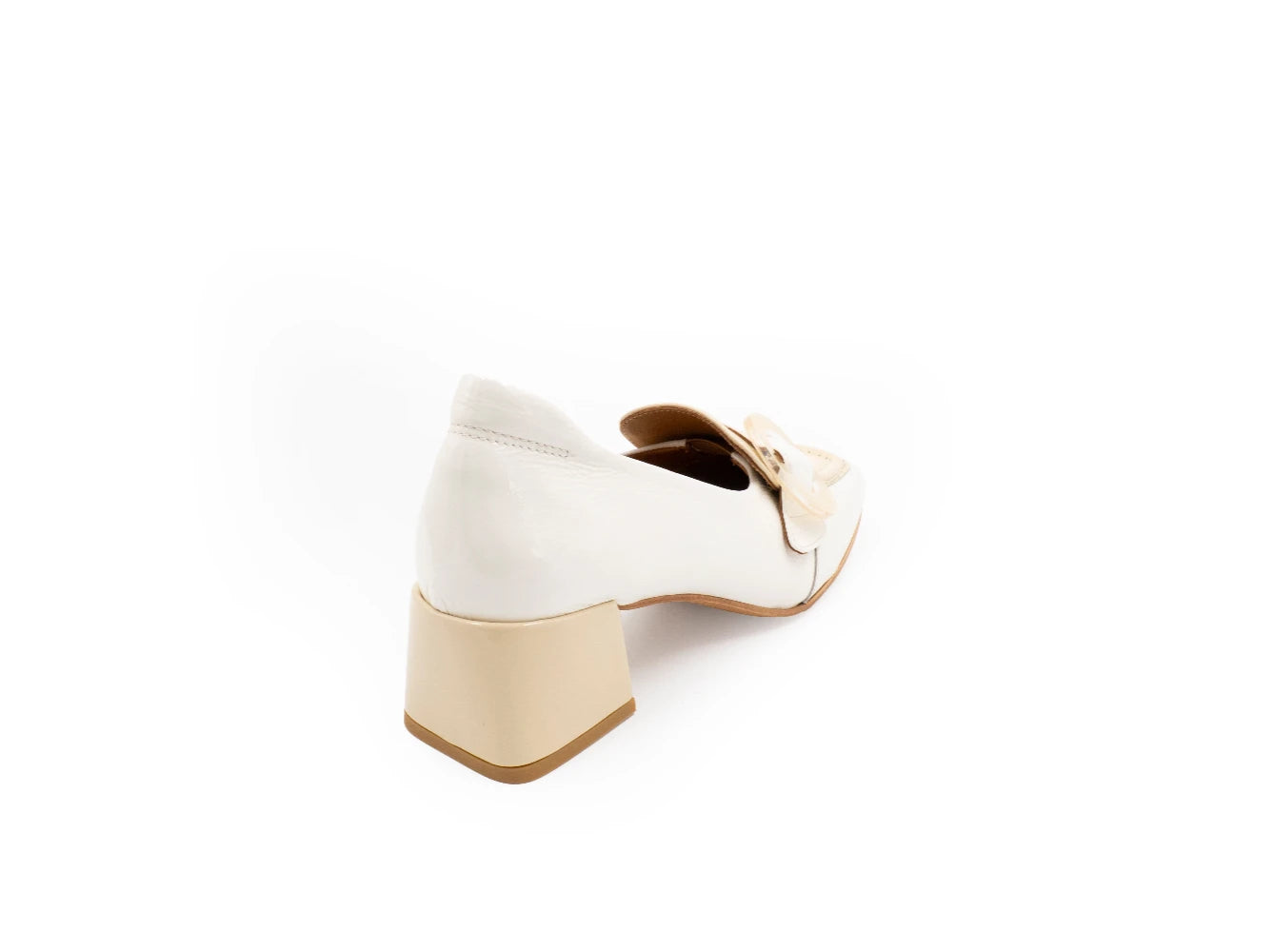 White shoe with a beige block heel on a white background