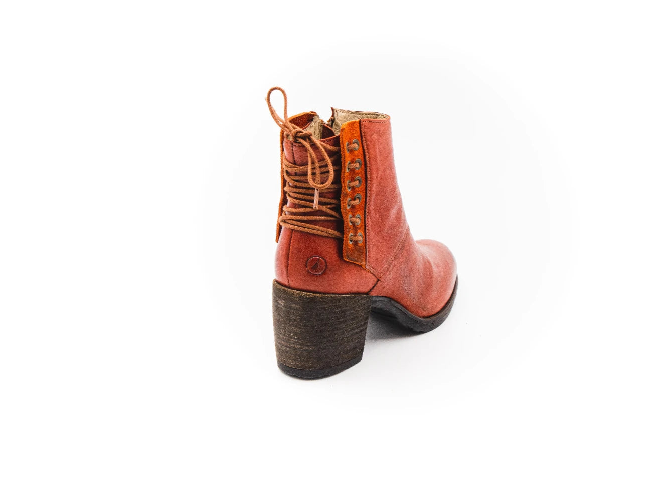 Brown leather boot with a block heel on a white background