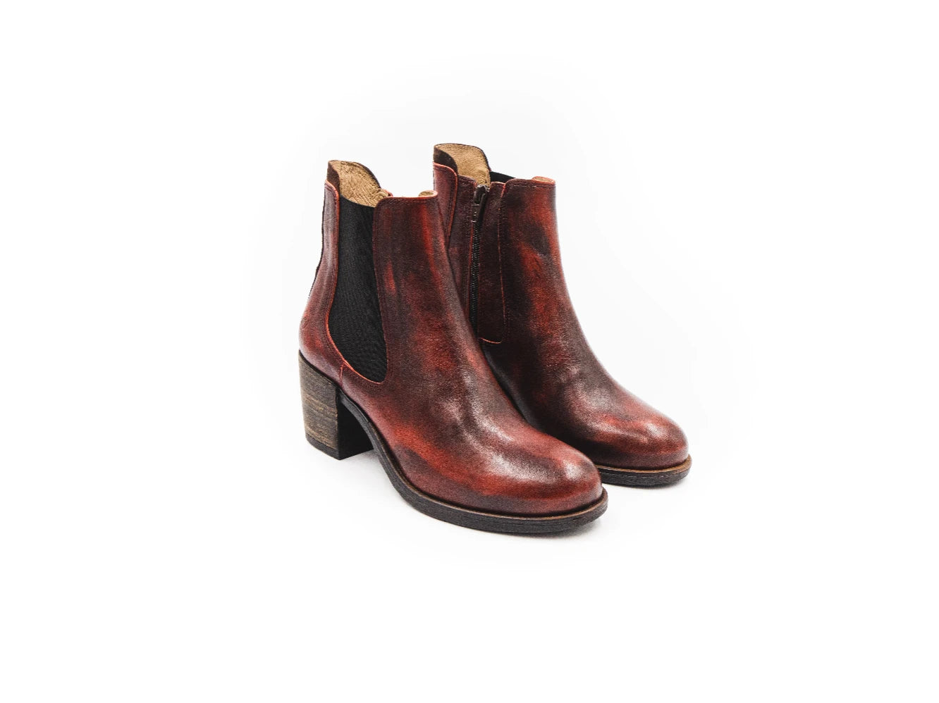 Pair of brown leather ankle boots on a white background