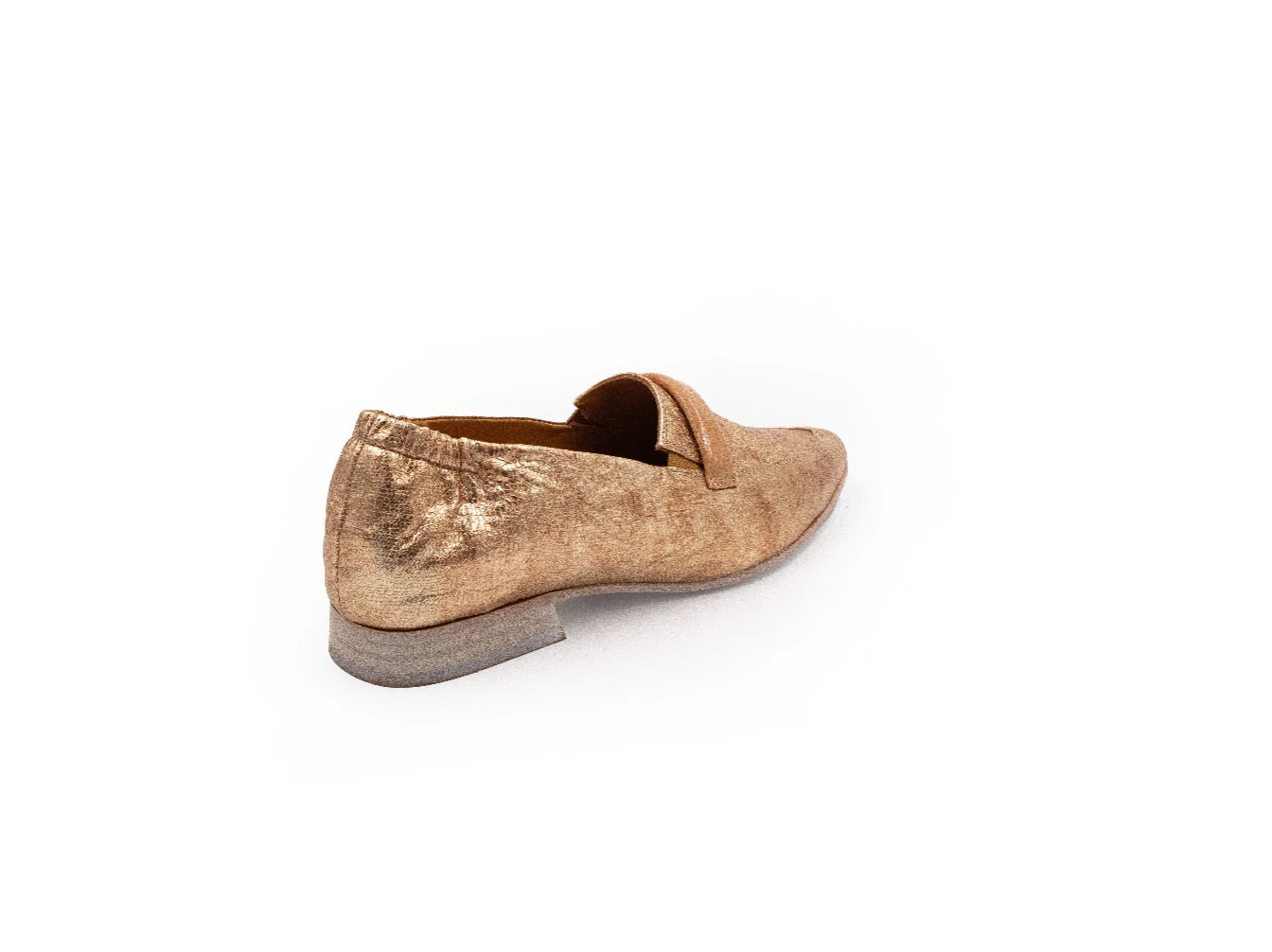 Bronze slip-on shoe on a white background