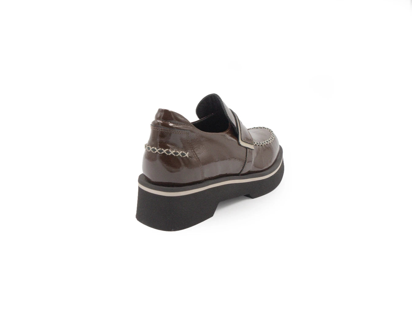 Brown patent leather shoe on a white background