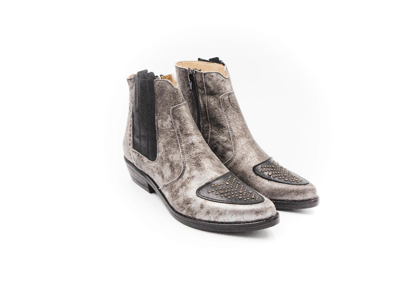 Pair of gray Chelsea boots with black zippers on a white background