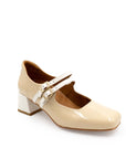Beige shoe with a white strap on a white background